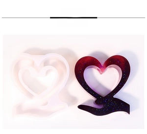 Macro view of a heart-shaped resin vase silicone mold with a finished red gradient piece