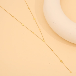 Detailed view of the gold Y-shaped titanium steel necklace with elegant teardrop charms