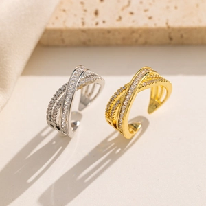 Close-up of double-layered silver and gold rings with micro-set cubic zirconia stones