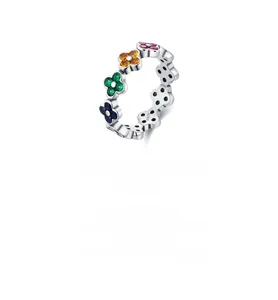 Macro detail of S925 sterling silver stamp on a colorful floral clover ring band