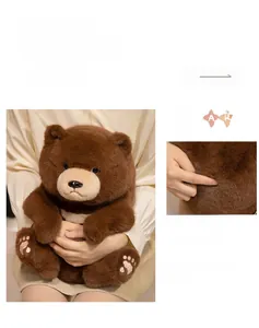 Detailed view of dark brown teddy bear plush with soft fur and embroidered paw pads
