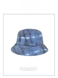 Close-up of the detailed stitching and tie-dye texture on the blue cotton bucket hat