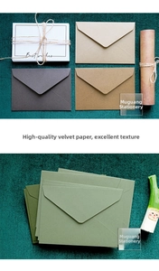 Detail of vintage velvet texture envelopes and cards with rustic twine in earth tones