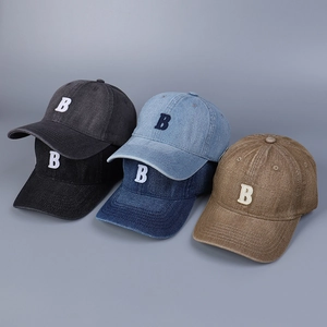 Detail of five colors of washed denim baseball caps with embroidered letter B design