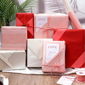 Lustrous oversized gift wrap set with ribbons and love cards in red and pearl shades