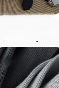 Detail of solid color crew socks showing the long-staple cotton knit texture and ribbed cuff