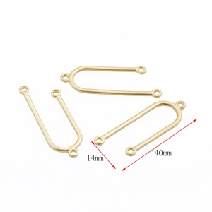 Detailed view of U-shaped jewelry connectors in matte gold finish with size measurements