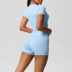 Back view of light blue short sleeve yoga top and high waist shorts set with pockets