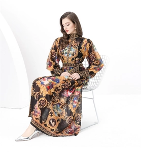 Detailed close-up of Baroque gold floral print and lantern sleeves on long dress