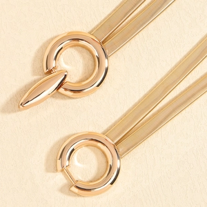 Elastic gold spring waist chain for dresses featuring a geometric circular buckle design