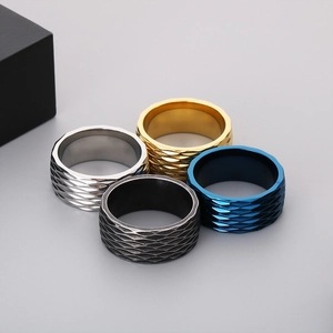 Macro detail of 10mm titanium steel rings featuring geometric fish scale textures