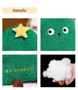 Detailed close-up of green plush Christmas tree pillow fabric, embroidery and filling