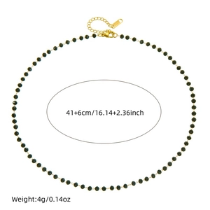 Bohemian black beaded chain necklace with golden extender chain on white background