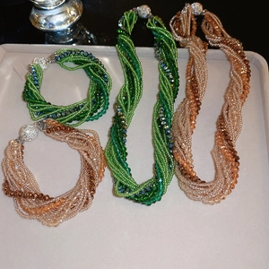 Macro detail of multi-strand beaded jewelry set with rhinestone magnetic clasps