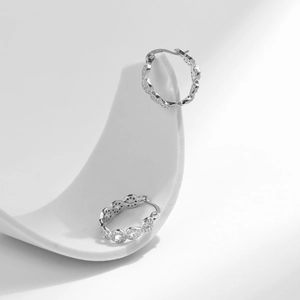 Elegant S925 sterling silver Mobius hoop earrings with shimmering cubic zirconia stones