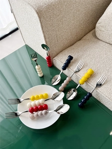 Detail view of 304 stainless steel cutlery with colorful ceramic candy-shaped handles