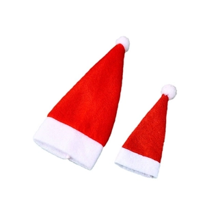 Pair of mini red Christmas Santa hats in two sizes for wine bottles or party decor