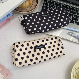 Detail of vintage floral polka dot corduroy pencil cases with large ring pull zippers