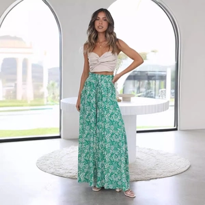 Women summer set with beige twist bandeau top and green floral high-waist wide-leg pants