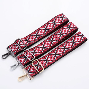 Ethnic geometric canvas handbag strap with adjustable metal buckles on white background