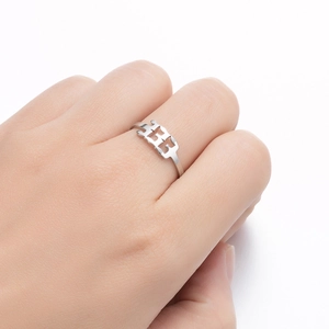 Detail showing an adjustable silver stainless steel ring with 111 angel number cutout