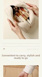 Macro detail of cream woven PU leather cosmetic bag with large capacity and zip closure