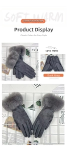 Close-up of gray suede gloves with plush fur cuffs and touchscreen finger detail
