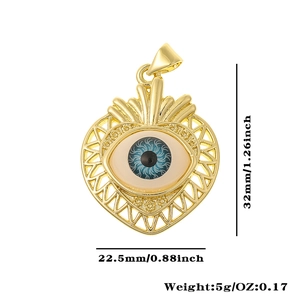 Macro view of gold heart eye pendant showing dimensions 32mm and 22.5mm and weight 5g