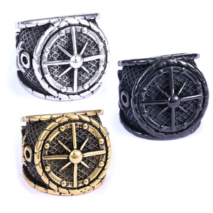 Detailed view of nautical helm rings in silver, black and gold finishes with mesh texture