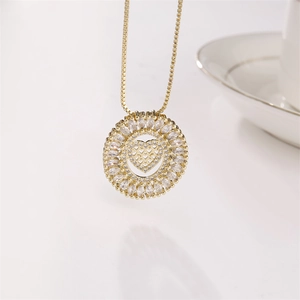 Gold-plated round necklace with sparkling cubic zirconia and hollow heart pendant