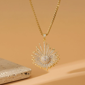 Golden square pearl necklace with a micro-pave zircon sunburst pendant on stone base