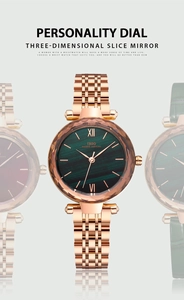 Detail view of IBSO lady watch featuring 3D cut glass and deep green ripple dial face