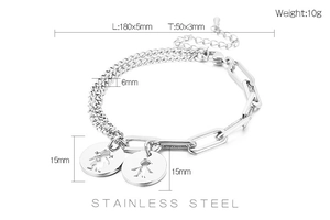 Detail of stainless steel paperclip chain bracelet with boy and girl hollow pendants