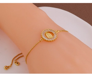 Detailed view of Virgin of Guadalupe charm bracelet with micro-p镶 inlaid zircons on wrist