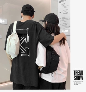 Street style crossbody bags in black and white with drawstring detail and wide straps