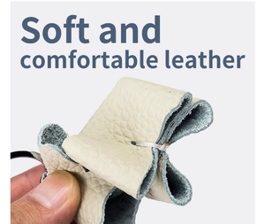 Macro view of soft cream-colored pebble grain leather showing its flexible texture