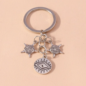 Creative silver sun and evil eye keychain accessory for bags and phone cases