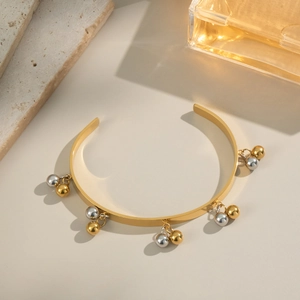 Bracciale aperto placcato oro 18 carati con ciondoli a sfera bicolore oro e argento