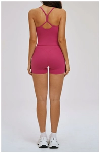 Detail of rose red yoga set showing Y-shaped back design and high waist fitness shorts