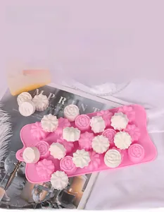 Detailed view of pink 15-cavity silicone flower mold with floral chocolate finished products