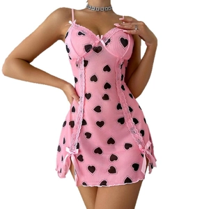 Pink heart print lace slip dress with bow detail and semi-sheer mesh fabric
