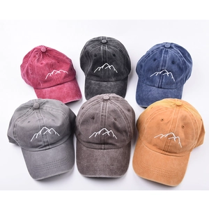 Collection of six vintage washed cotton baseball caps with mountain embroidery