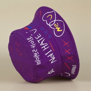 Detail of purple cotton bucket hat with street style graffiti text and heart prints