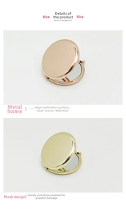 Close-up of portable round metal makeup mirror with polished rose gold and gold finishes