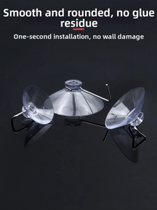 Three transparent PVC vacuum suction cups with durable metal hooks on a black surface