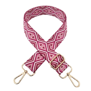 Close-up of geometric diamond pattern strap with golden metal swivel hooks and buckle