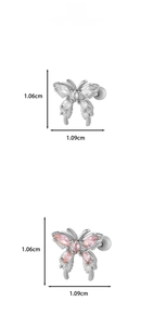 Détail des boucles d'oreilles papillon avec pierres en zircone blanches et roses
