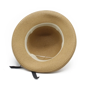 Detail of summer straw hat showing internal sweatband and adjustable drawstring