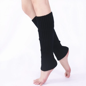 Detail showing high-quality black ribbed knit texture and soft yarn on leg warmers