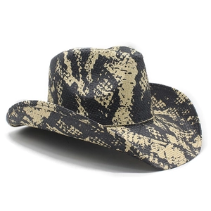 Detail of western cowboy straw hat featuring textured yellow and black snake print